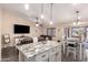 Beautiful kitchen with island and open floor plan to dining and living areas at 14514 N 128Th Dr, El Mirage, AZ 85335