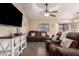 Relaxing living room with comfortable sofas, stylish decor, and a view to the backyard at 14514 N 128Th Dr, El Mirage, AZ 85335