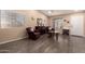 Bright living room with neutral walls, and hardwood flooring, and tastefully curated decor create a comfortable ambiance at 14514 N 128Th Dr, El Mirage, AZ 85335