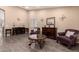 Spacious living room with hardwood floors, elegant decor, and plenty of natural light, perfect for relaxation at 14514 N 128Th Dr, El Mirage, AZ 85335