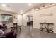 Bright living room with neutral walls, and hardwood flooring, and tastefully curated decor create a comfortable ambiance at 14514 N 128Th Dr, El Mirage, AZ 85335