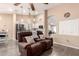 Inviting living room with a leather reclining love seat and view of the kitchen at 14514 N 128Th Dr, El Mirage, AZ 85335