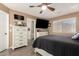 Comfortable main bedroom with dresser and TV; ensuite bathroom is also visible at 14514 N 128Th Dr, El Mirage, AZ 85335