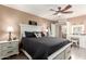 Spacious main bedroom features wood-look floors, white trim, and ceiling fan at 14514 N 128Th Dr, El Mirage, AZ 85335
