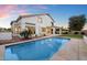 Inviting backyard showcasing a pool, well-manicured lawn, and a covered outdoor patio at 14862 N 90Th Pl, Scottsdale, AZ 85260