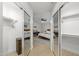 Bright bedroom with mirror closet doors, ceiling fan, wooden floors, and stylish decor at 14862 N 90Th Pl, Scottsdale, AZ 85260