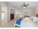 Main bedroom with ensuite, flatscreen TV and multiple windows allowing ample light at 14862 N 90Th Pl, Scottsdale, AZ 85260