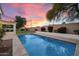 Beautiful backyard pool with lush landscaping and an inviting patio area, perfect for relaxation at 14862 N 90Th Pl, Scottsdale, AZ 85260