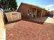 Backyard with shed, patio, and low-maintenance gravel landscaping at 14950 W Rockrose Way, Surprise, AZ 85374
