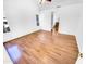 A bright bedroom with hardwood floors and a view into the bathroom at 14950 W Rockrose Way, Surprise, AZ 85374