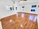 Bright living room featuring hardwood floors, white walls, and ample natural light at 14950 W Rockrose Way, Surprise, AZ 85374