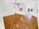 Open-concept living room with hardwood floors, white walls, and natural light at 14950 W Rockrose Way, Surprise, AZ 85374