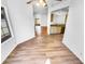 Bright living room with hardwood floors flowing into an open-concept kitchen at 14950 W Rockrose Way, Surprise, AZ 85374