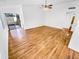 A bright living room with hardwood floors and a sliding glass door to the outside at 14950 W Rockrose Way, Surprise, AZ 85374
