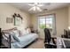 Comfortable bedroom featuring a daybed, soft carpet, and bright natural light at 15054 N 173Rd Dr, Surprise, AZ 85388