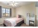 Cozy bedroom features a comfortable bed, carpet flooring, and vanity area at 15054 N 173Rd Dr, Surprise, AZ 85388