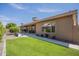 Private backyard featuring a well-maintained lawn, patio, and lovely landscaping at 1562 E Gleneagle Dr, Chandler, AZ 85249