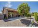Charming backyard featuring a covered patio, mature landscaping, and a serene ambiance at 1562 E Gleneagle Dr, Chandler, AZ 85249