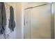 Bathroom featuring a glass door shower with a tile surround, plus towel rack with hanging towels at 1562 E Gleneagle Dr, Chandler, AZ 85249