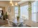 Bright eat-in kitchen area with lots of natural light and hanging pothos at 1562 E Gleneagle Dr, Chandler, AZ 85249