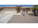 Charming single-story home featuring a low-maintenance desert landscape, attached garage, and inviting front entrance at 1562 E Gleneagle Dr, Chandler, AZ 85249