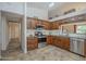 Kitchen with stainless steel appliances, granite countertops, and plenty of cabinet space for storage and organization at 1562 E Gleneagle Dr, Chandler, AZ 85249