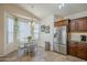 Bright kitchen and dining area featuring stainless steel appliances, stylish cabinets and a cheerful atmosphere at 1562 E Gleneagle Dr, Chandler, AZ 85249