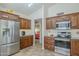 Well-appointed kitchen with stainless steel appliances, granite countertops, and ample cabinet space at 1562 E Gleneagle Dr, Chandler, AZ 85249