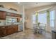 Eat-in kitchen with tile floors, stainless steel appliances, and a cozy breakfast nook by the bay window at 1562 E Gleneagle Dr, Chandler, AZ 85249
