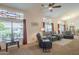 Comfortable living room features large windows with decorative glass, plush seating, and a cozy atmosphere at 1562 E Gleneagle Dr, Chandler, AZ 85249