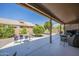 Relaxing covered patio overlooking the yard, ideal for outdoor entertaining and leisure at 1562 E Gleneagle Dr, Chandler, AZ 85249