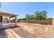 Open backyard area with covered patio, perfect for entertaining, and easy desert landscaping at 15808 N 164Th Ln, Surprise, AZ 85388