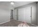 Bedroom with a large closet and neutral-colored walls, offering a calm space with natural light and soft carpet at 15808 N 164Th Ln, Surprise, AZ 85388