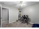 Bedroom featuring a ceiling fan, neutral-colored walls, carpeted floors, with a bookshelf and an electronic drum set at 15808 N 164Th Ln, Surprise, AZ 85388