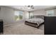 Spacious bedroom boasts two large windows and neutral carpet creating a cozy retreat at 15808 N 164Th Ln, Surprise, AZ 85388