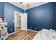 A neatly arranged blue bedroom provides a serene and organized space for relaxation at 15808 N 164Th Ln, Surprise, AZ 85388