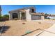 Two-story home featuring neutral paint, tile roof, and a spacious two-car garage with desert landscaping at 15808 N 164Th Ln, Surprise, AZ 85388