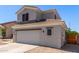 Two-story home featuring neutral paint, tile roof, and a spacious two-car garage with low maintenance landscaping at 15808 N 164Th Ln, Surprise, AZ 85388
