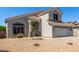 Two-story home featuring neutral paint, tile roof, and a spacious two-car garage with desert landscaping at 15808 N 164Th Ln, Surprise, AZ 85388