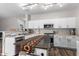 Bright kitchen featuring a center island and stainless steel appliances against clean, white cabinetry at 15808 N 164Th Ln, Surprise, AZ 85388