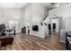 Bright living room with wood floors, staircase, and a two-story vaulted ceiling for an open concept feel at 15808 N 164Th Ln, Surprise, AZ 85388