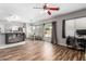 Bright and open living area with hardwood floors and sliding glass doors to the backyard at 15808 N 164Th Ln, Surprise, AZ 85388