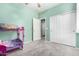 Bedroom featuring soft carpet, light green walls, and closet with white doors at 17290 N 170Th Ln, Surprise, AZ 85374