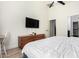 Comfortable bedroom featuring wood floors, a dresser, and lots of natural light at 17290 N 170Th Ln, Surprise, AZ 85374