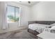 Bedroom featuring soft carpet, white walls, and a window at 17290 N 170Th Ln, Surprise, AZ 85374
