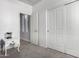 Bedroom featuring soft carpet, white walls, and closet with sliding doors at 17290 N 170Th Ln, Surprise, AZ 85374