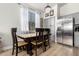 The dining room features a rustic table and chairs with direct access to the kitchen at 17290 N 170Th Ln, Surprise, AZ 85374