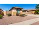 Single-story home with desert landscaping, showcasing low maintenance and appealing curb appeal at 17290 N 170Th Ln, Surprise, AZ 85374