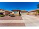 Inviting single-story home features a tile roof, two-car garage and desert landscaping for easy maintenance at 17290 N 170Th Ln, Surprise, AZ 85374