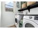 Well-organized laundry room with modern washer and dryer at 17290 N 170Th Ln, Surprise, AZ 85374